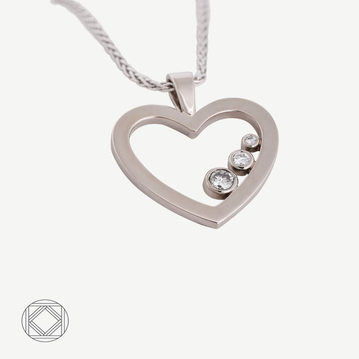Pendentif coeur or gris et diamants